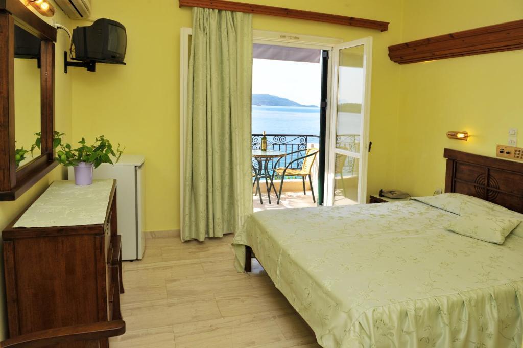 Logan'S Beach Hotel Nidhrion Rum bild