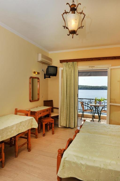 Logan'S Beach Hotel Nidhrion Rum bild